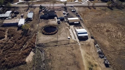 2016: Barren Rectangular Plot With Rimmed Round Depression And Buildings Abuts A Stock Footage 69920488