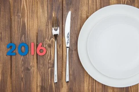 2016 concept, white plate with fork and knife 库存照片