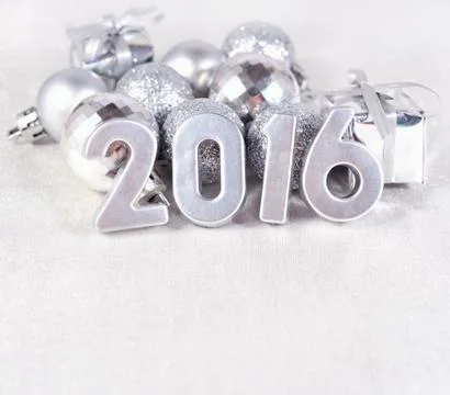2016 year silver figures and silvery ?hristmas decorations Stock Photos