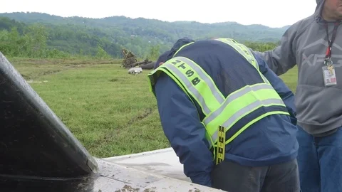 2017 - Field investigators from the NTSB document the wreckage of a cargo plane Video stock 85645935