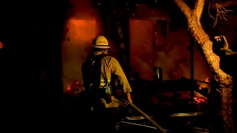 2017 - a firefighter fights a huge hillside blaze during the Thomas Fire in Stock Footage 92170300