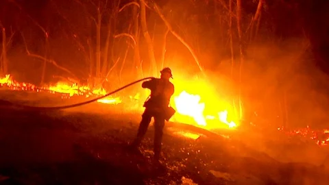 2017 - firefighters work hard to contain brush fires burning out of control Stock Footage 92170207