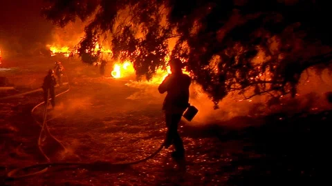 2017 - firefighters work hard to contain brush fires burning out of control Stock Footage 92170229