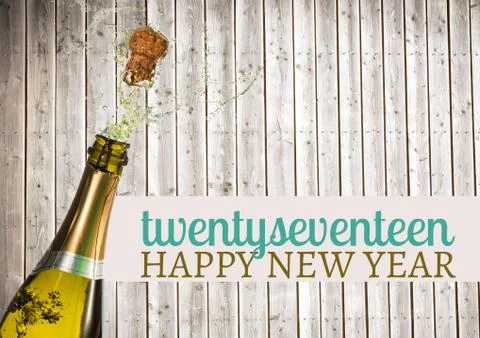 2017 happy new year wishes with opened champagne bottle Stock Photos