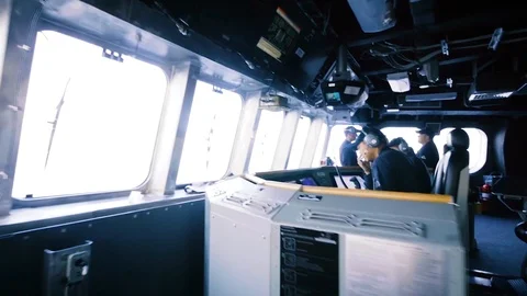 2017 - US Navy sailors sit at the controls of the USS Gabrielle Giffords. Stock Footage 88662838