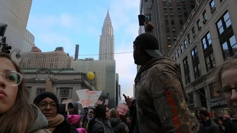 2017 Women's March protesters in the shadow of the Chrysler Building Stock Footage 89630453