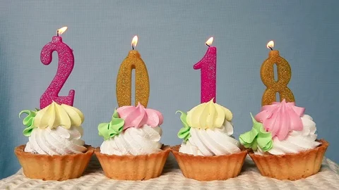 2018 Happy new year, number candles on cupcakes Stock Footage 80791843