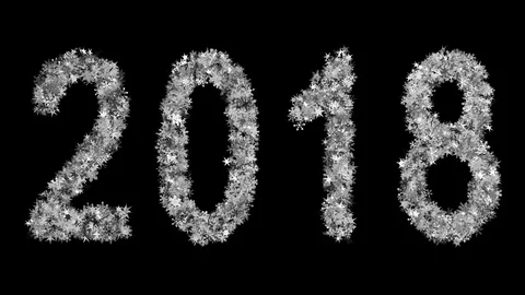 2018 New Year inscription consisting of growing snowflakes. Black Background. Stock Footage