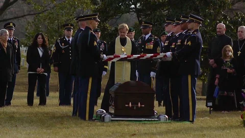 2018 - A priest offers the final prayers over US Army Sgt. Mihail Golins burial Stock Footage 92624693