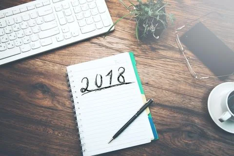 2018 text on notepad with keyboard on table Stock Photos