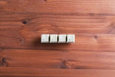 2018 word on computer keyboard keys on wooden background. New Year concept Stock Photos