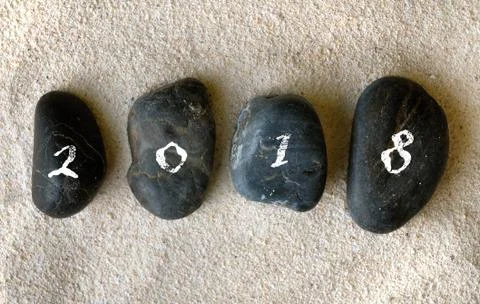 2018 written on black pebbles Stock Photos
