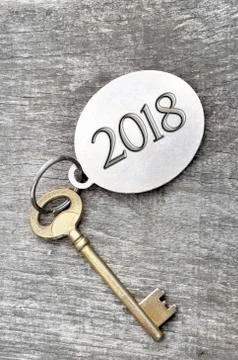2018 written on a ring with an old golden key Stock Photos