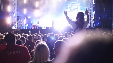 2019-08-09 - Mariupol, Ukraine. MFest festival. Woman sits on boyfriend Stock Footage 214664568
