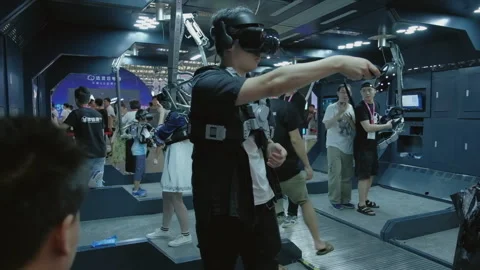 2019 Aug 04, Shanghai. Attendees test virtual reality and motion capture gear Stock Footage 345908123