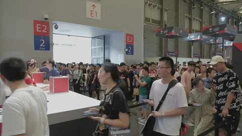 2019 Aug 04, Shanghai. Crowd of event attendees queuing to enter convention Stock Footage 345793490