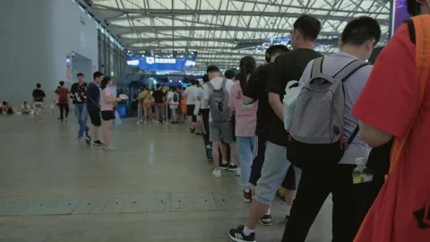 2019 Aug 04, Shanghai. Crowd of event attendees waiting in a long winding queue Stock Footage 345908301