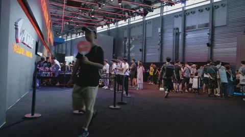 2019 Aug 04, Shanghai. Crowds queuing and walking by the branded AORUS booth Stock Footage 345912774