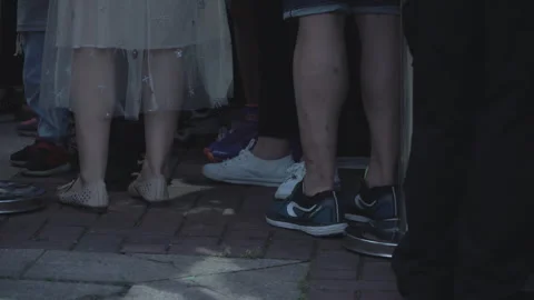 2019 Jun 08, Jiaxing. Close-up of lower legs and feet of people standing Stock Footage 345137245