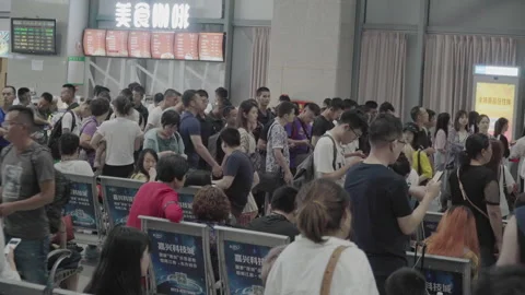 2019 Jun 09, Jiaxing. Large crowd of travelers waiting in a long line Stock Footage 345723553