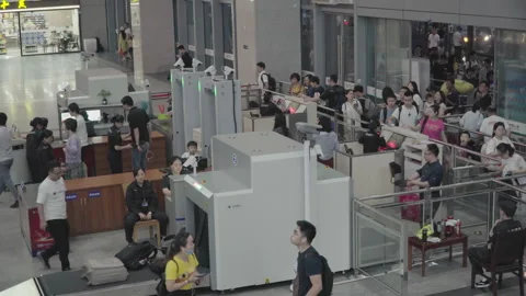 2019 Jun 09, Jiaxing. Passengers queue orderly for security screening 動画素材 345723129