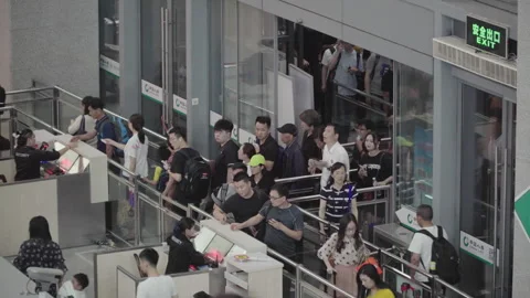 2019 Jun 09, Jiaxing. Passengers wait in orderly security check queue 動画素材 345723201