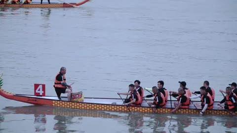 2019 Jun 10, Jiaxing. Dragon boat paddlers racing on calm river Stock Footage 336313689
