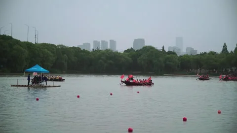 2019 Jun 10, Jiaxing. Rowing teams racing on urban river in haze Stock Footage 338289838