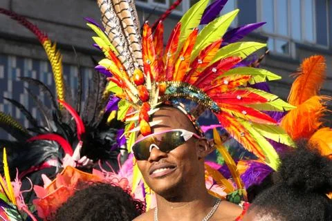 2019 notting hill carnival man costume with feathers in head Stock Photos