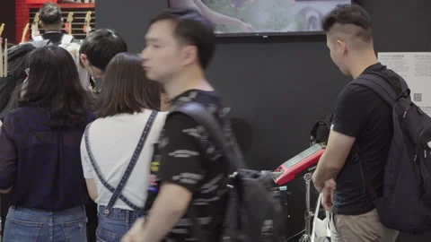 2019 Oct 13, Shanghai. Attendees test and observe electronic percussion Stock Footage 345916966