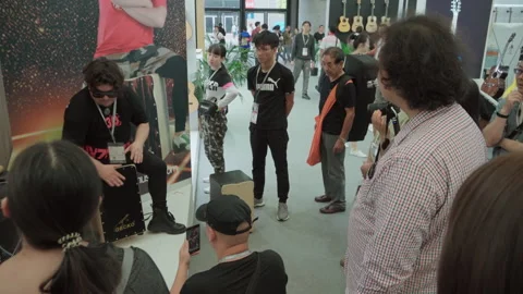 2019 Oct 13, Shanghai. Attendees watch cajon drum demonstration Stock Footage 345924013