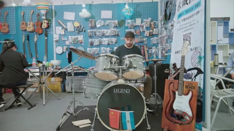 2019 Oct 13, Shanghai. Bearded man plays drum kit Stock Footage 345922232