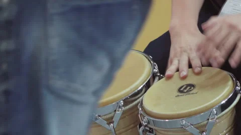 2019 Oct 13, Shanghai. Close-up of musicians hands playing wooden bongo and Stock Footage 345927894