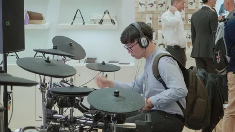 2019 Oct 13, Shanghai. Focused man playing electronic drums Stock Footage 345923472