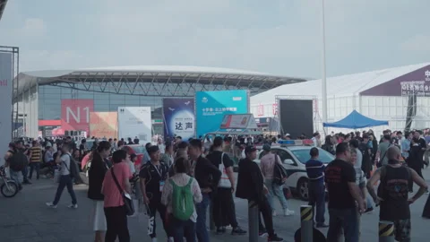 2019 Oct 13, Shanghai. Large crowd of convention attendees mill Stock Footage 345920904