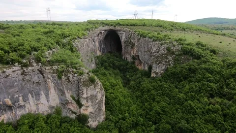 2019, Spring Drone View of Prohodna Cave "God's Eyes" near Karlukovo Stock Footage 323382637