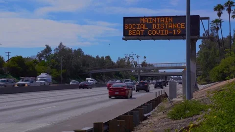 2020 - freeway sign advises to maintain social distance during Covid-19 corona Stockbeeldmateriaal 126921448