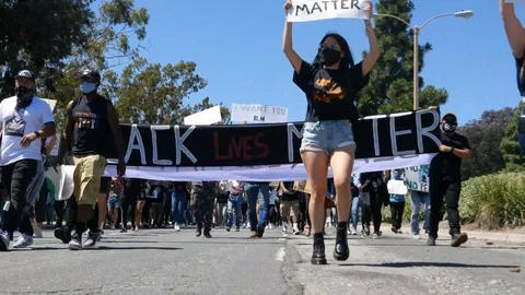 2020 - marching protesters activists during a Black Lives Matter BLM march in Stock-Footage 132441534