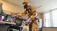 2020 - Members Of The National Guard Sanitize An Office Workspace During The Stock Footage