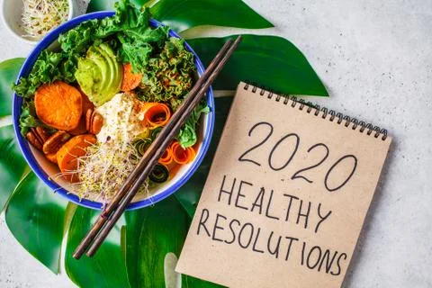 2020 new year, healthy resolutions. Buddha bowl with avocados, sweet potatoes Stock Photos