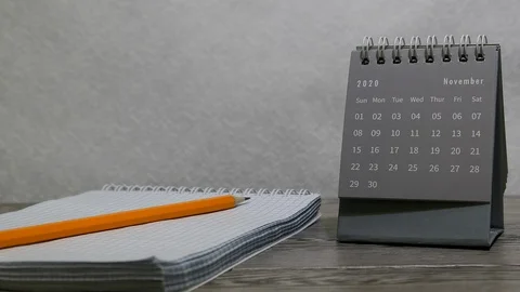 2020 Year Gray Mini Monthly Standing Desk Calendar November Month Panning Slider Stock Footage 128553810