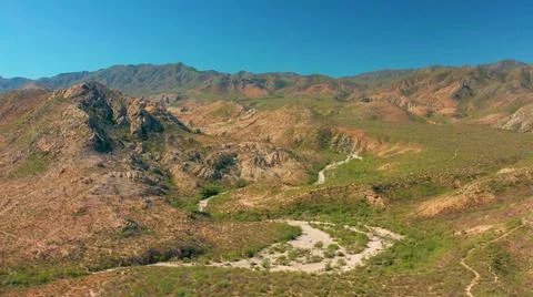 2020:CABO PULMO BCS MEXICO.Beautiful Fly Through Green Mountains Stock Photos