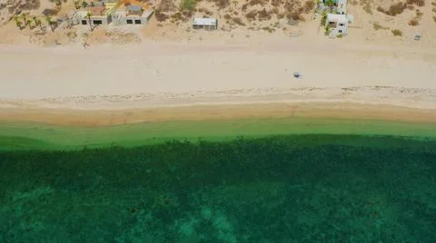 2020:EL SARGENTO LA VENTANA MEXICO.Very Green Water In Sea With Homes Along The Stock Photos
