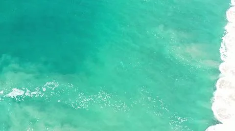 2020:LOS CABOS MEXICO.Teal Colored Ocean Lapping Shore Stock Photos