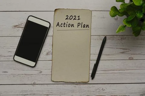 2021 action plan text on burnt edge brown paper Stock Photos