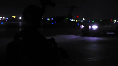 2021 - Afghan refugees make it to safety and are ushered onto planes by U.S. Stock Footage 159811577