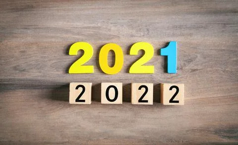 2021 and 2022 with cube on the table. Happy new year Stock Photos