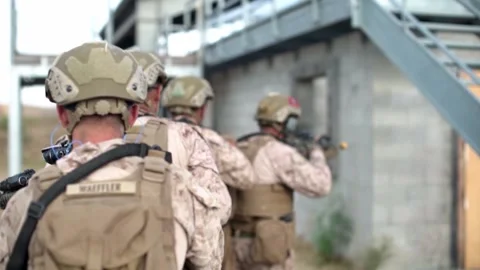 2021 Combat Engineers breach a door using small explosives before entering a Stock Footage 159334639