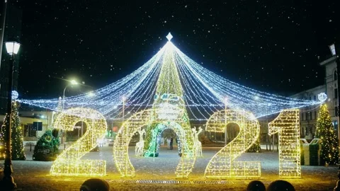 2021 in large size decorated with multiple lights and globes, which reflects the Stock Footage 145128611