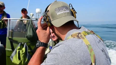 2021 - Members of the US Air Force 57th Rescue Squadron motor toward a downed Stock Footage 241786355
